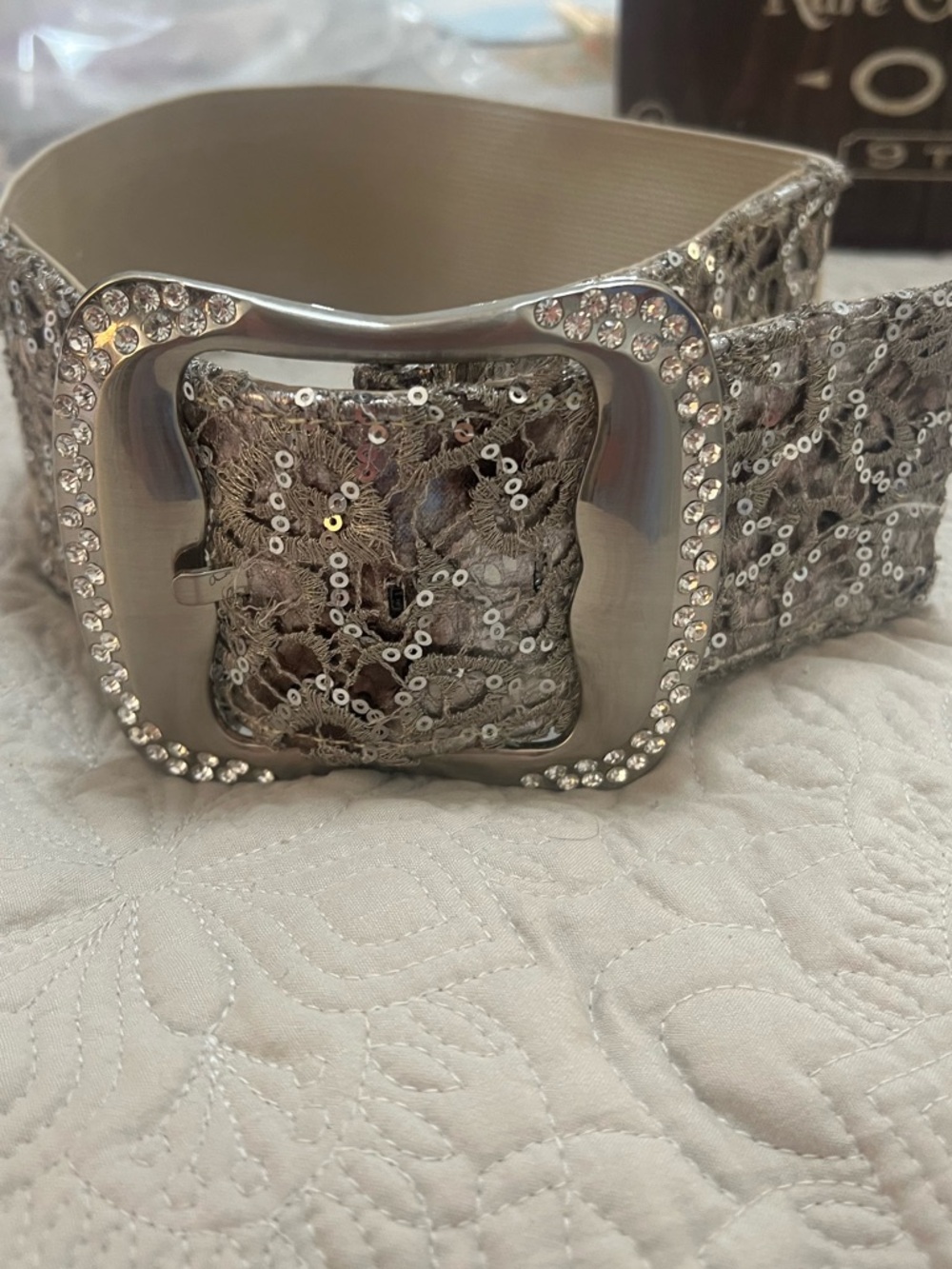 BKE brand lace belt for women featuring a rhinestone buckle.